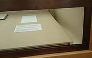 The photo shows an empty display case in a museum