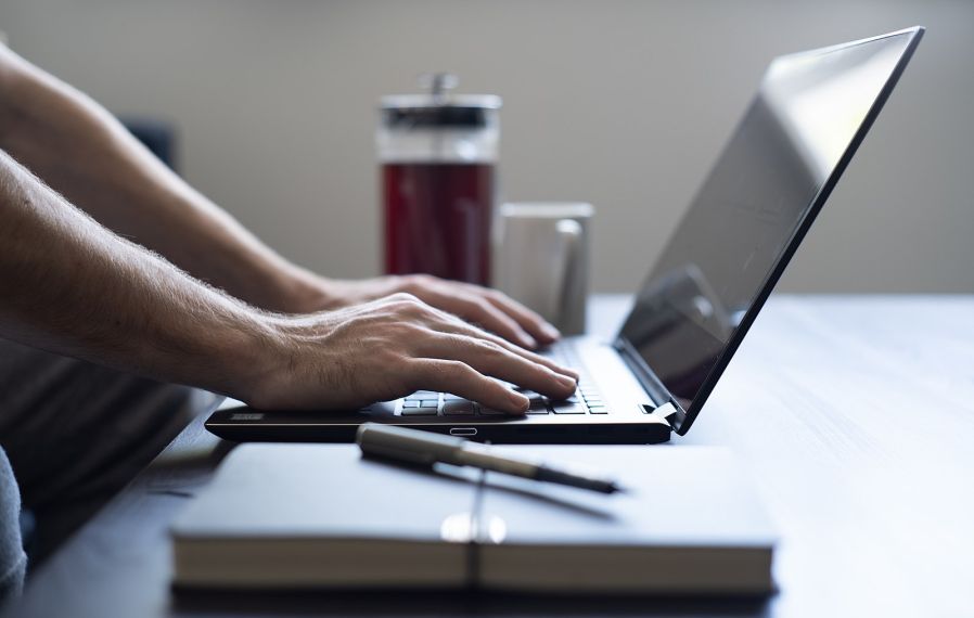 Working From Home Laptop And Notepad