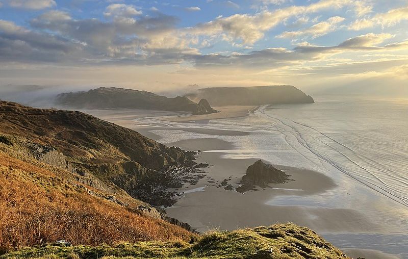 Sunrise over Three Cliffs Bay in Gower