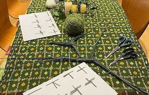 Table laid out for Brigid cross making at Imbolc