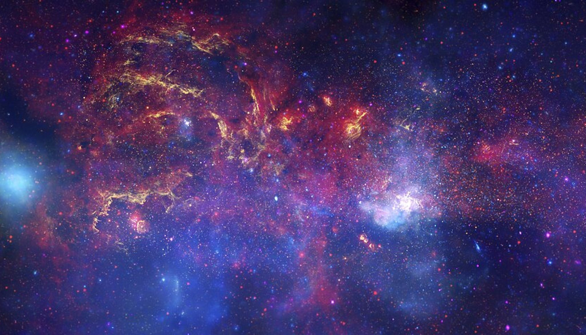 The centre of the Milky Way, with glowing clouds of gas and dust in purple, blue, red and gold, scattered with stars