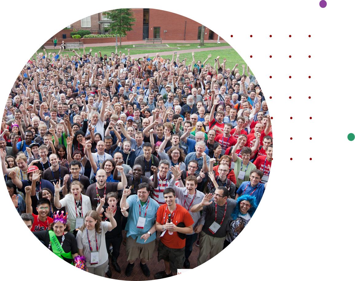 Large group photo of cheering conference attendees