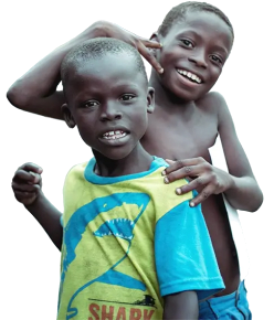 Two smiling boys posing together, one with his arm around the other