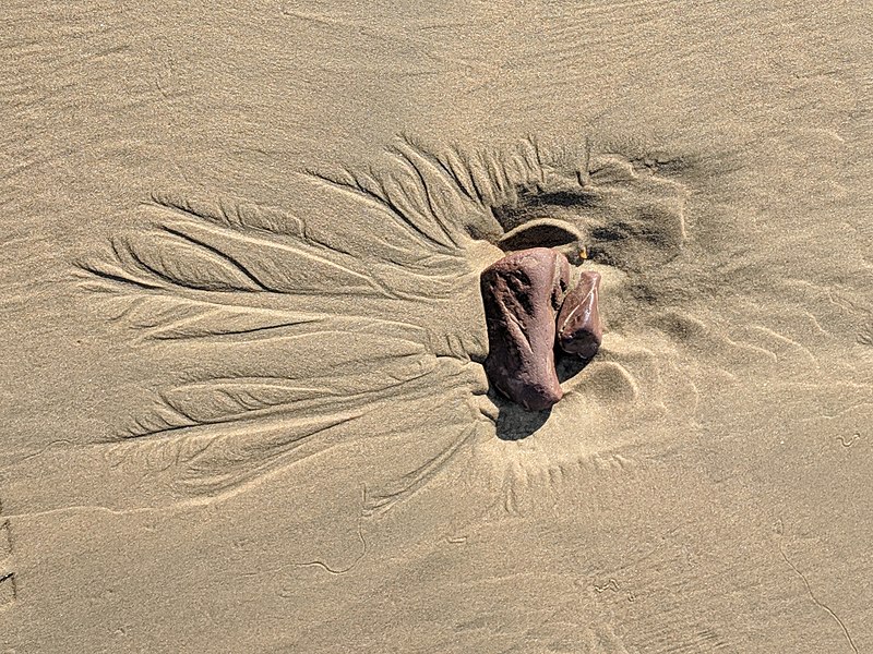 Rock on a sandy beach